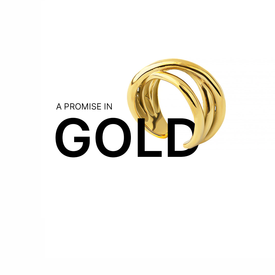 Bold 18K gold-plated ring with a layered, twisted design displayed above the phrase "A PROMISE IN GOLD," where the word "GOLD" is partially overlaid by the ring, set against a clean white background.