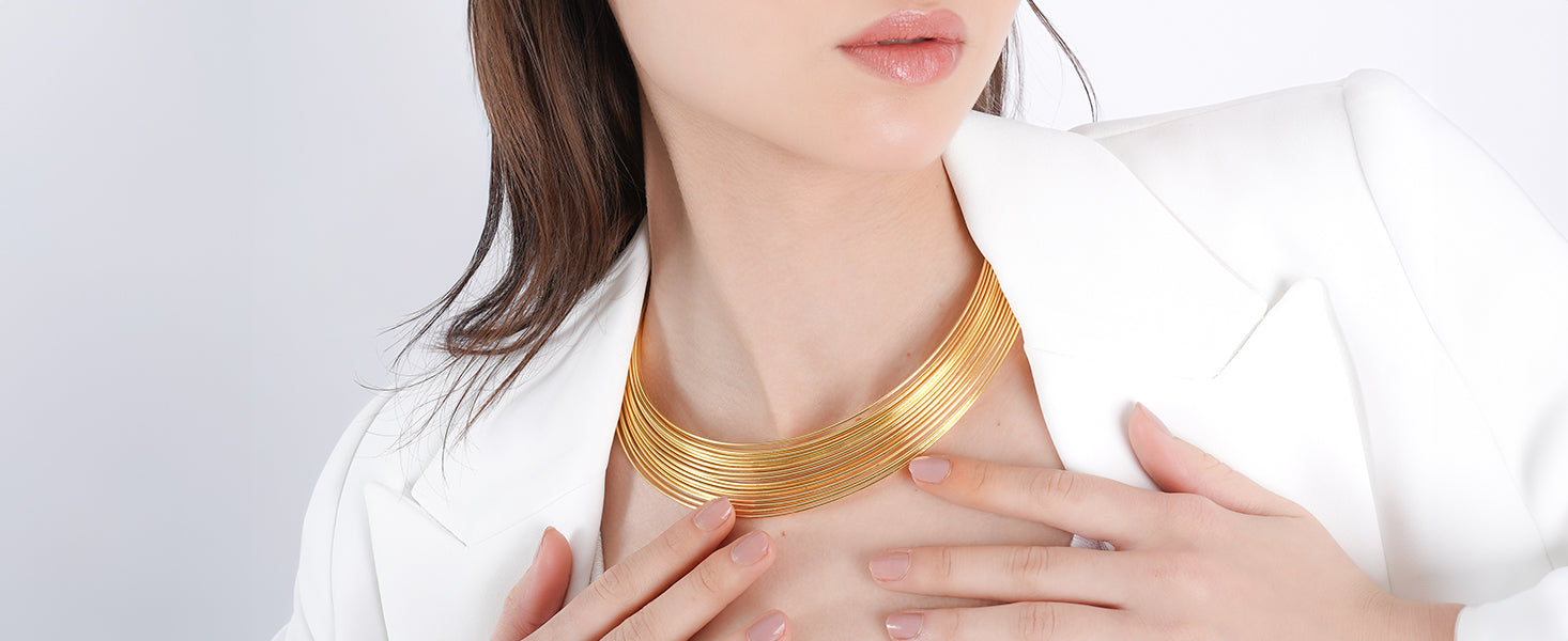 18K gold-plated choker necklace featuring sleek, layered metal bands. A bold and elegant statement piece for a refined look.
