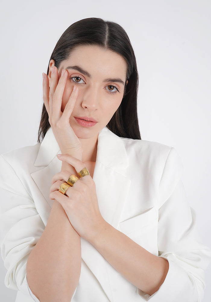 18K gold-plated statement rings with a textured, artistic finish. A bold yet sophisticated accessory for modern elegance.
