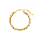 18K gold-plated braided chain bracelet with a polished finish and adjustable clasp, offering a refined and versatile accessory.