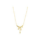 18K gold-plated necklace featuring a flowing, abstract drip pendant and a delicate chain, offering a modern artistic statement.
