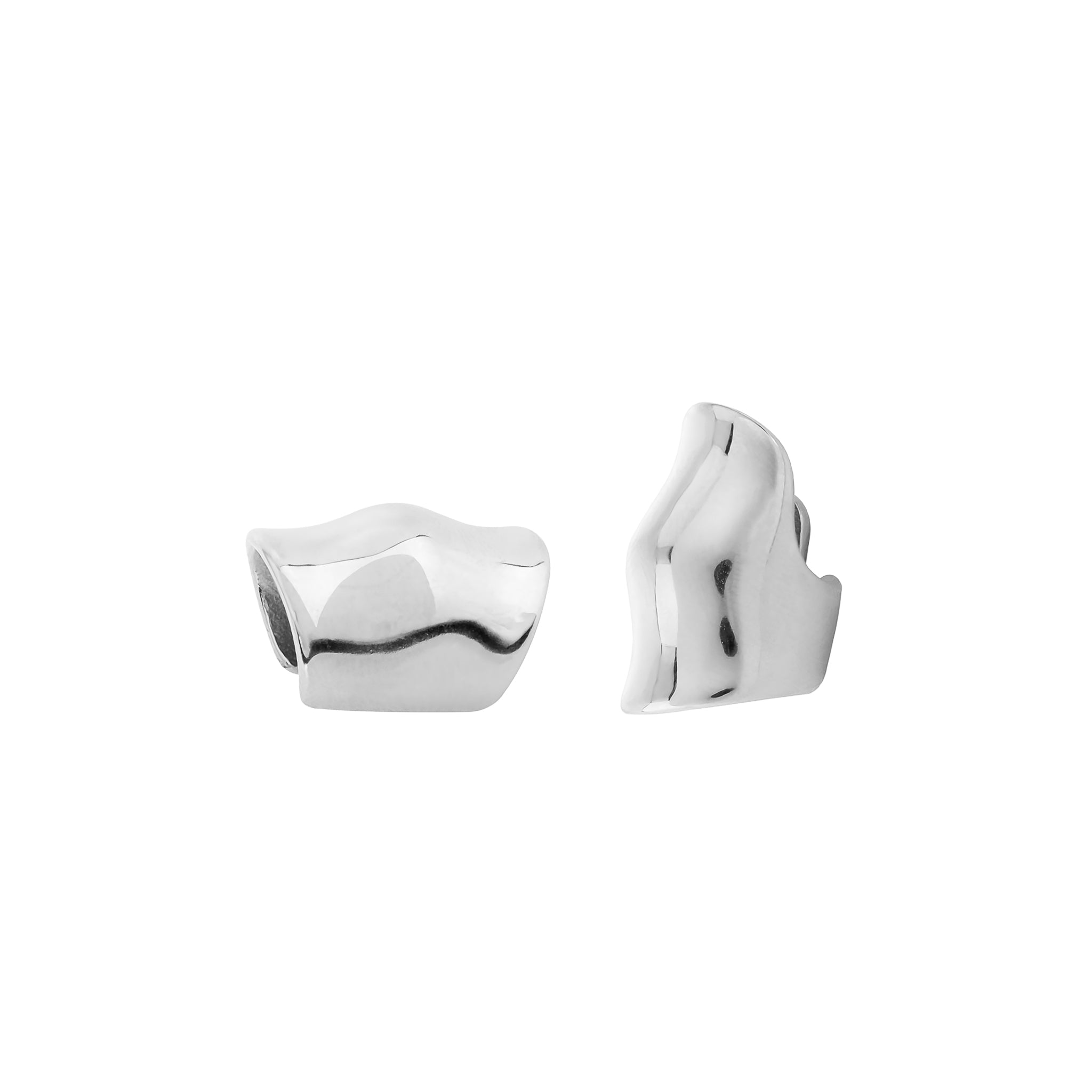 Close-up view of silver plated ear cuffs, showcasing their smooth, wavy, and contemporary design with a glossy finish.