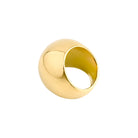 A sleek, dome-shaped gold-plated statement ring with a highly polished surface, reflecting light elegantly.