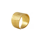 A textured 18k gold-plated wide band ring featuring a distinct brushed design, crafted for bold elegance and luxurious appeal.