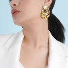 18K gold-plated organic-shaped stud earrings featuring a glossy, fluid design, exuding elegance and bold individuality. Perfect for modern statement styling. 