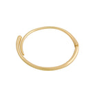 Gold-plated minimalist choker necklace with a sleek, curved design and open-ended structure.