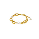 Gold chain bracelet with pearls on a white background