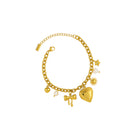 Gold bracelet with various charms on a white background