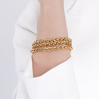 Elegant 18K gold-plated rope chain bracelets, layered for a bold yet timeless look. The intricate twisted design adds texture and dimension, making them perfect for stacking or wearing solo as a statement piece.