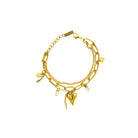 Gold bracelet with various charms on a white background
